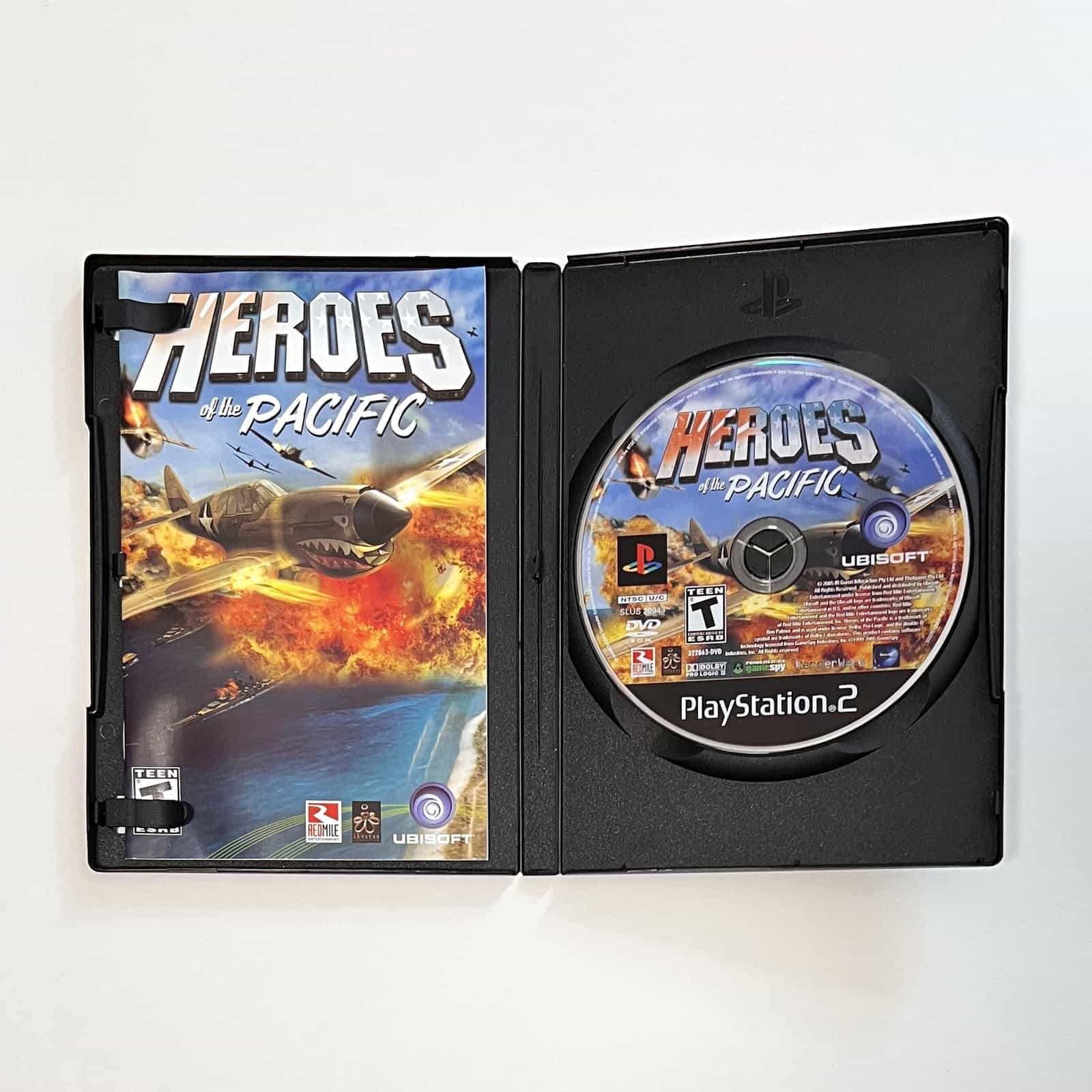 Heroes of the Pacific PS2 case open with disc and manual