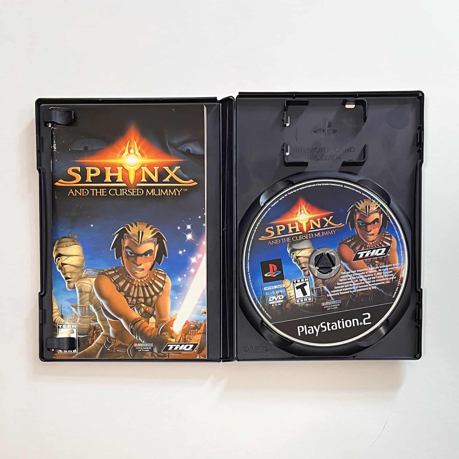 Sphinx and the Cursed Mummy PS2 case open with disc and manual
