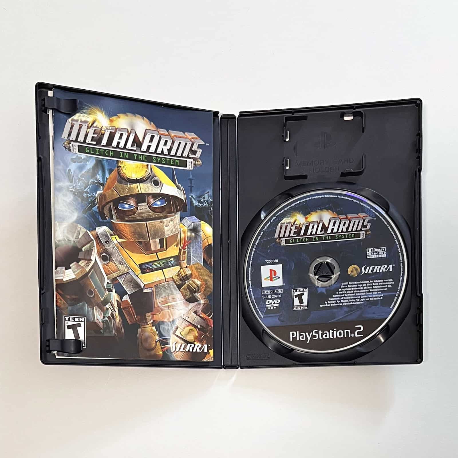 Metal Arms: Glitch in the System PS2 case open with disc and manual