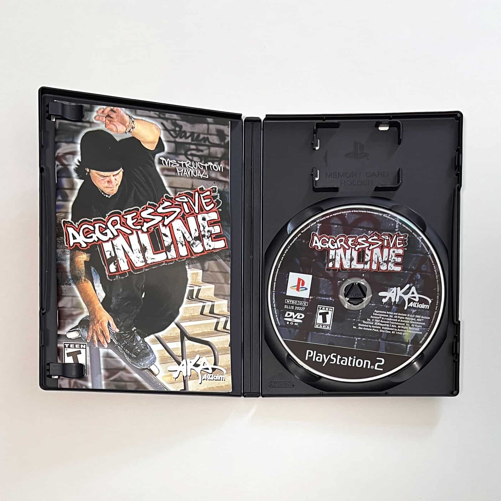 Aggressive Inline PS2 case open with disc and manual