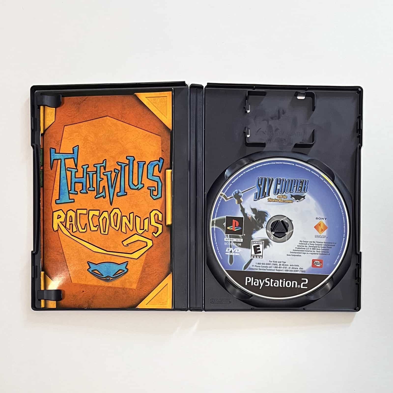 Sly Cooper and the Thievius Raccoonus PS2 case open with disc and manual