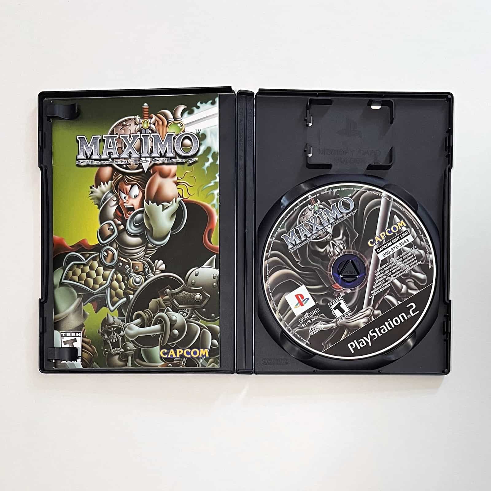 Maximo: Ghosts to Glory PS2 case open with disc and manual